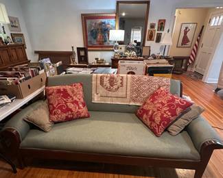 Restored antique sofa with mahogany frame and wool upholstery.