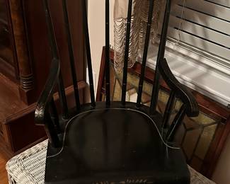 Beautiful antique child's rocking chair with spindle back.