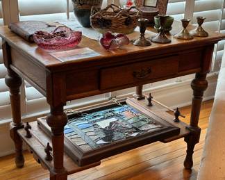 Sweet oak side table with rales and a single drawer. Also, custom stained glass panel with a Southwest theme, Murano glass and local art.