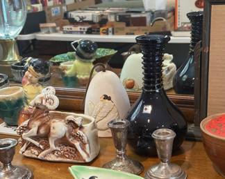 Blenko handmade vase, retro planters and several sets of sterling silver candlesticks.