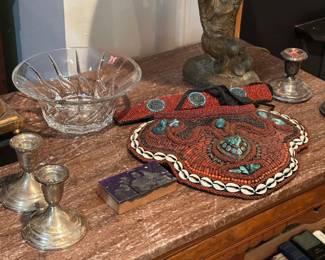 Tibetan coral , turquoise and glass bib. Pink marble top table and very old cast brass or iron lamp.