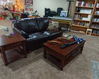 Leather loveseat and wood tables