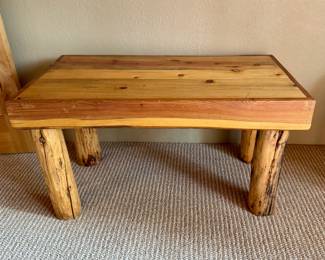 One of three rustic benches