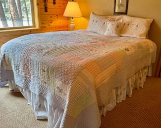 Queen bed and lots of bedding