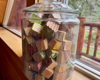 Large jar filled with vintage toy blocks