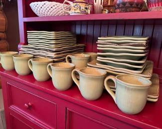 Large set of sage green square dishess