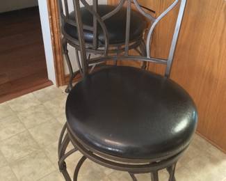 2 iron swivel bar stools