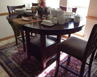 Bar height table with inlaid design and 6 chairs