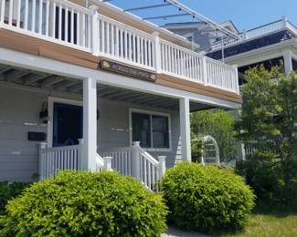 Newer vinyl railing; newer awning - awning is navy with white piping
