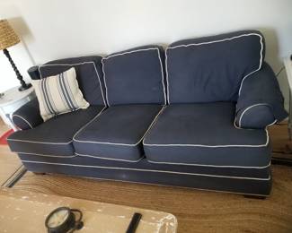 Navy couch with white piping mfg. by Flexsteel