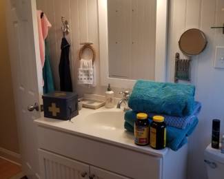 Pretty white bath vanity; vanity mirror; vanity light