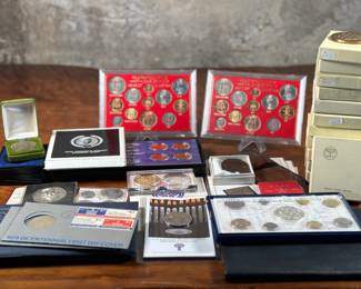 This lot features a very large collection of vintage medals, tokens, and coins from around the world. Many are still in the original packaging.