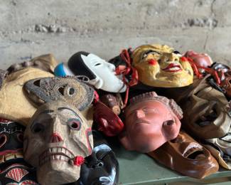 This lot features a massive mask collection with over 100 items in total. Everything on the table is included in this lot and features masks from around the world made with various mediums and in various conditions.