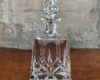 This lot features a Gorham “Lady Anne” whiskey decanter. This Gorham Lady Anne whiskey decanter measures (with lid), 12” H x 5.5” W x 3.5” D. The Gorham Manufacturing Company, founded in 1831 by Jabez Gorham in Providence, RI, is known for its high-quality silver and silver plate. Gorham is famous for producing a wide range of products, including flatware, hollowware, and decorative items. They also specialized in sculptural foundry work, even building the world’s largest bronze-casting foundry by 1890. While Gorham is primarily known for its silver, it also produced other goods, including crystal.