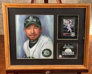 This lot features a framed toon collectible of Seattle Mariners, Ichiro Suzuki. This item measures in the frame, 12” H x 15” W. Ichiro Suzuki, born October 22, 1973, is a legendary baseball player with a career spanning both Japan’s Nippon Professional Baseball (NPB) and Major League Baseball (MLB). He is recognized for his exceptional hitting, speed, and fielding skills, and is the first Japanese-born position player to be inducted into the Baseball Hall of Fame.
