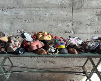 This lot features a massive mask collection with over 100 items in total. Everything on the table is included in this lot and features masks from around the world made with various mediums and in various conditions.