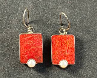 This lot features a pair of vintage sterling silver earrings with what appears to be Pearls and Coral. Marked 925 on the back with a total approx. weight of 8.25 grams.