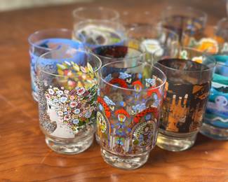 A set of German annual commemorative drinking glasses, designed by Franz Barta. 14 glasses in total. Each glass measures 4.5″ H x 2.75″ W.