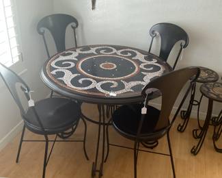 Metal bistro table-39”round x 30”. 4 chairs-16x36