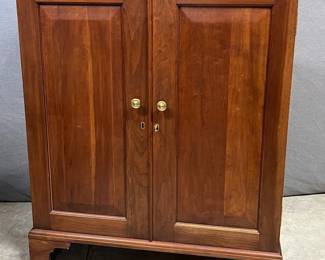 Cherrywood bench made two door raised panel cabinet