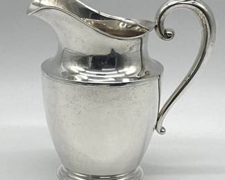Sterling water pitcher by Wallace