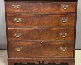 Mahogany flamed veneer front cottage chest with scalloped skirt