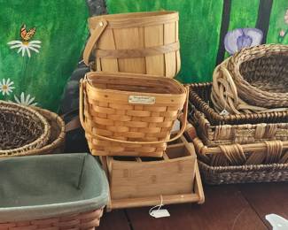 A variety of baskets, including Longaberger collectables