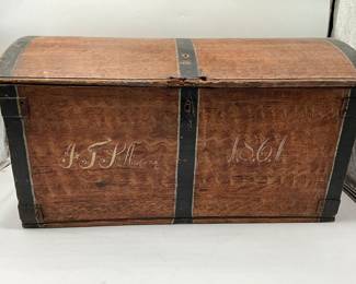 Antique Folk Art Immigrant chest or trunk offers grain painted wood construction with central date of 1861, strap hinges and interior patch box and drawers as
photographed