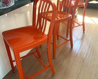 Orange metal bar stools
