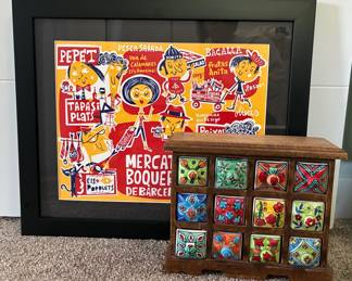 Framed artwork and multi drawer spice cabinet