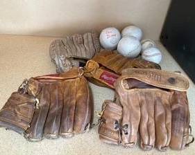 4 Baseball Gloves, 2 Baseballs and 3 Softballs