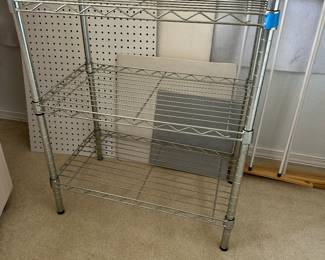 Variety of metal shelving in several rooms - on casters - easy to disassemble and move to your destination.