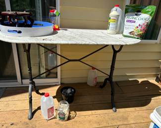 Metal legged marble table - long oval in nice condition.