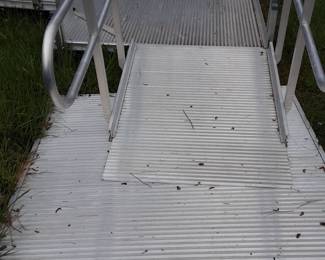 Aluminum wheel chair ramp and base. These are 6 ft. sections. Has ramp to ramp.