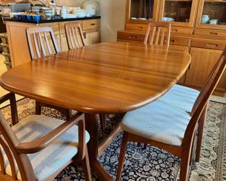 Mid Century Table  with 2 hidden leaves, 6 chairs. 4 chairs have original upholstery, 2 have been recovered. 