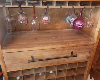 Home bar upper Wine Glass rack; Lower bottle pocket rack; center cutting board and large Drawer $100.
