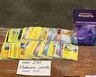 OVER 250 POKMON CARDS AND TIN