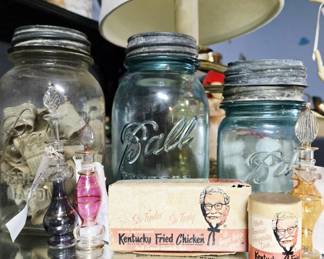 Ball jars, perfume bottles, and KFC advertising.