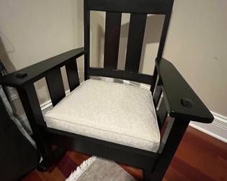 Wood rocking chair with upholstered seat cushion