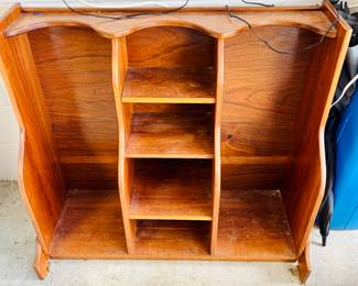 Get rid of that wire rack contraption and store your clubs in fashion with wood. No, it will not help your game.