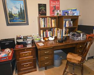 hardwood desk, wood file cabinet, books, CDs, DVDs