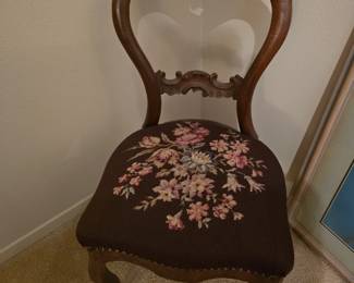 Antique chair with needlepoint cushion seat