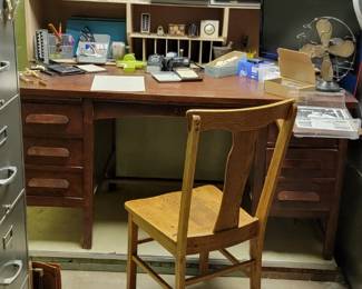 vintage wooden desk with office supplies