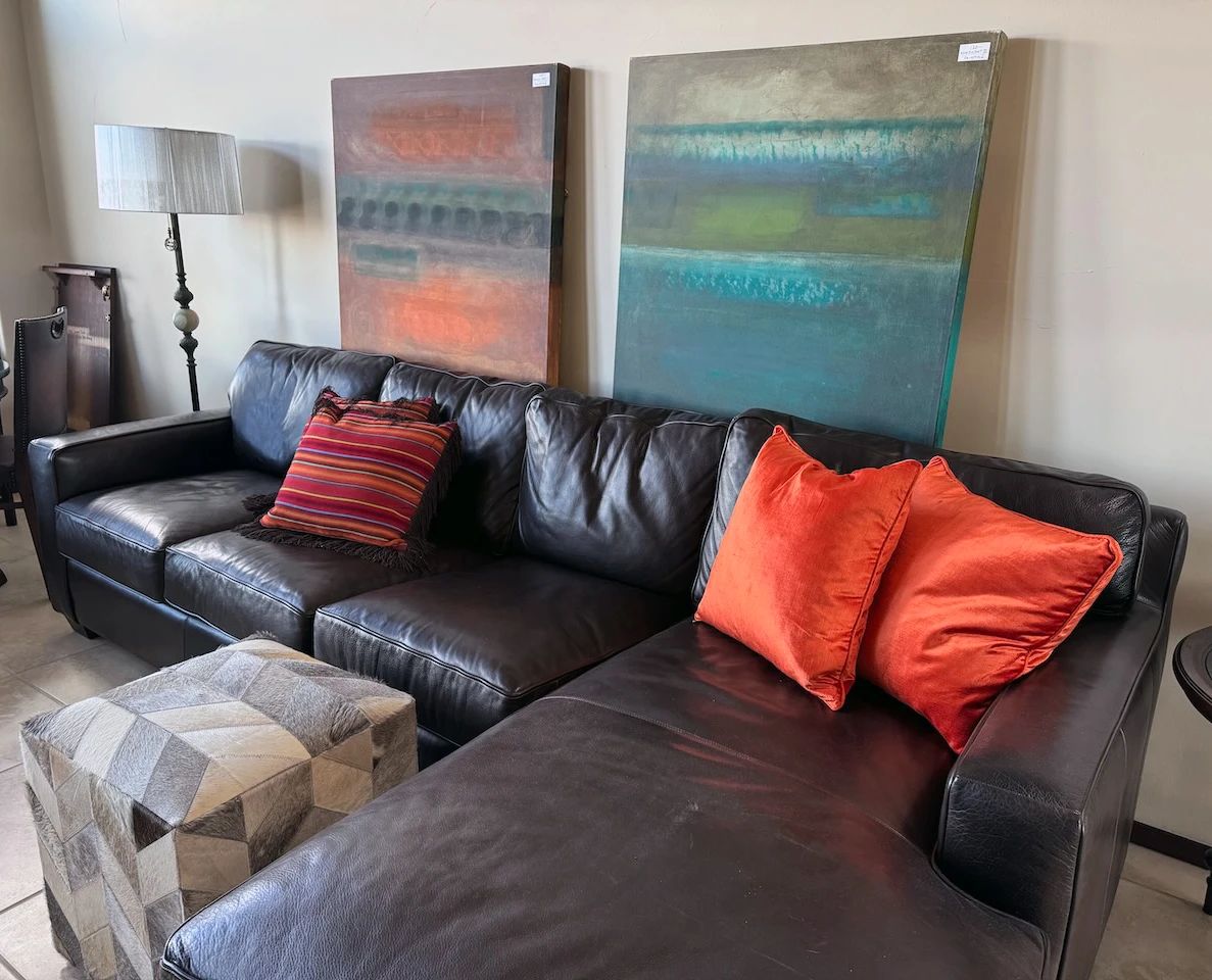 Leather sectional sofa, artwork + decor