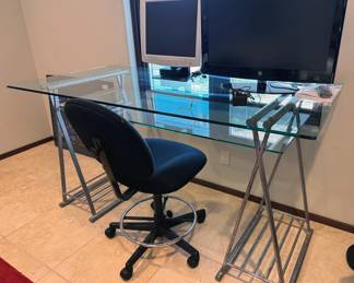 Glass + metal desk, office chair, monitors