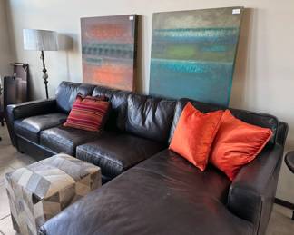 Leather sectional sofa, artwork + decor