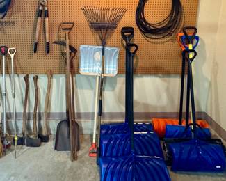Multiple Snow Shovels • Rake • Shovel • Sickle • Loppers • Electrical Cord • Several Axes • Sprinklers