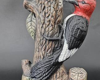 Ceramic Red-Headed Woodpecker Perched on Trunk