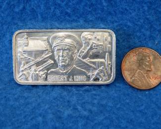 Lot 318. 1977 Lincoln Mint WWII commemorative sterling silver bar. 44.1 grams.