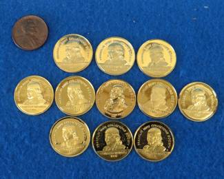 Lot 400. 33.3 grams of 24kt gold electroplated sterling silver collector coins